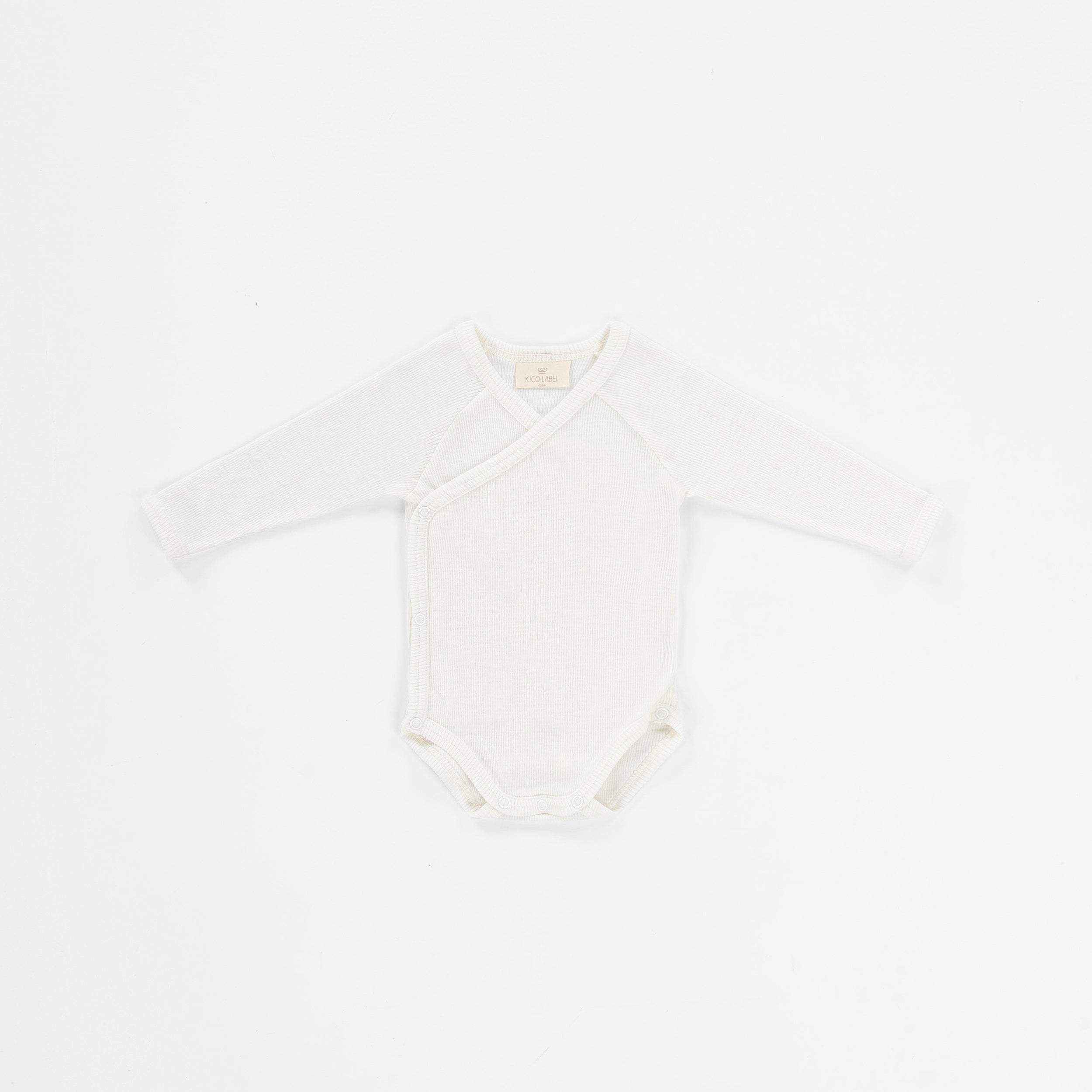 Witte merinowollen overslagromper